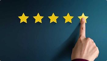 person`s hand pointing at five yellow stars on blue background