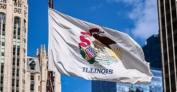 Illinois state flag with seal flying in downtown Chicago