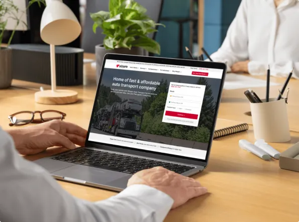 Get an instant and free car shipping quote online customer using a laptop to get an instant car shipping quote on the website