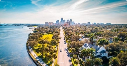 florida to texas car shipping route on coastal highway with palm trees