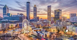 georgia to texas car shipping route with atlanta skyline at dusk