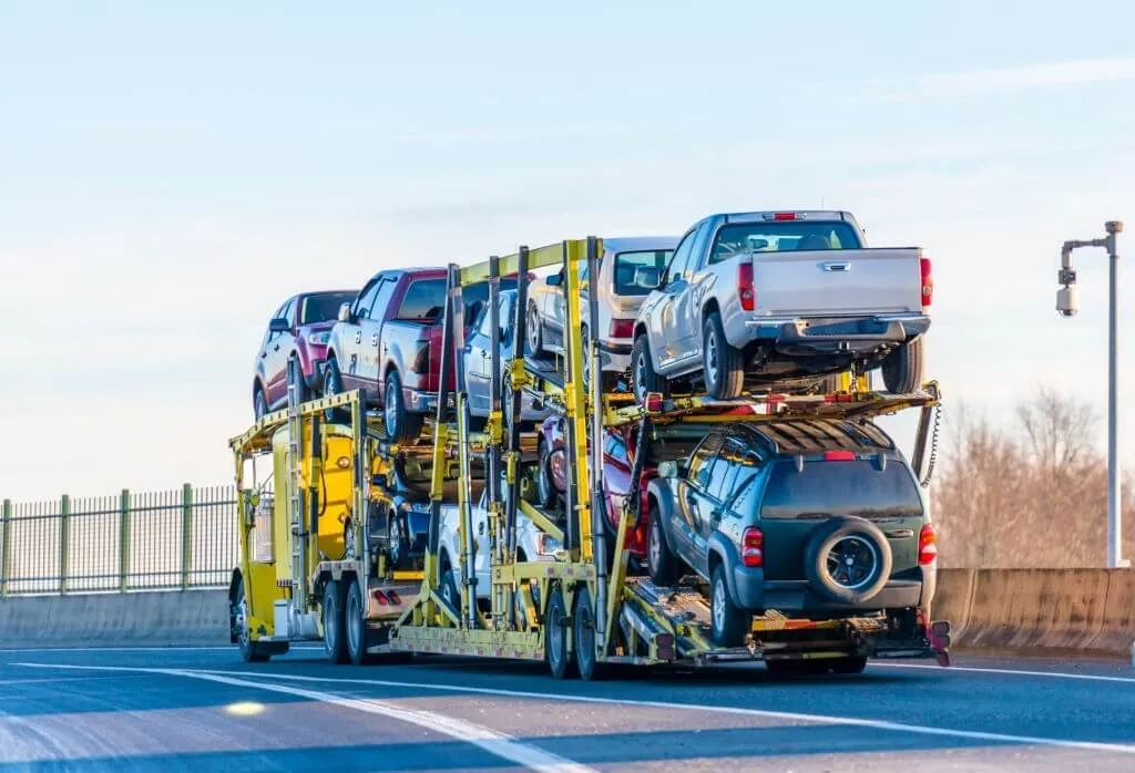 open-car-carrier-hauling-pickup-trucks-and-suvs