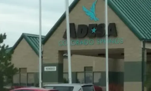 ADESA Colorado Springs auto auction building exterior with signage and entrance visible