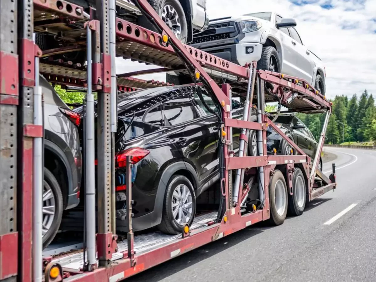 open-car-transport-trailer-on-highway