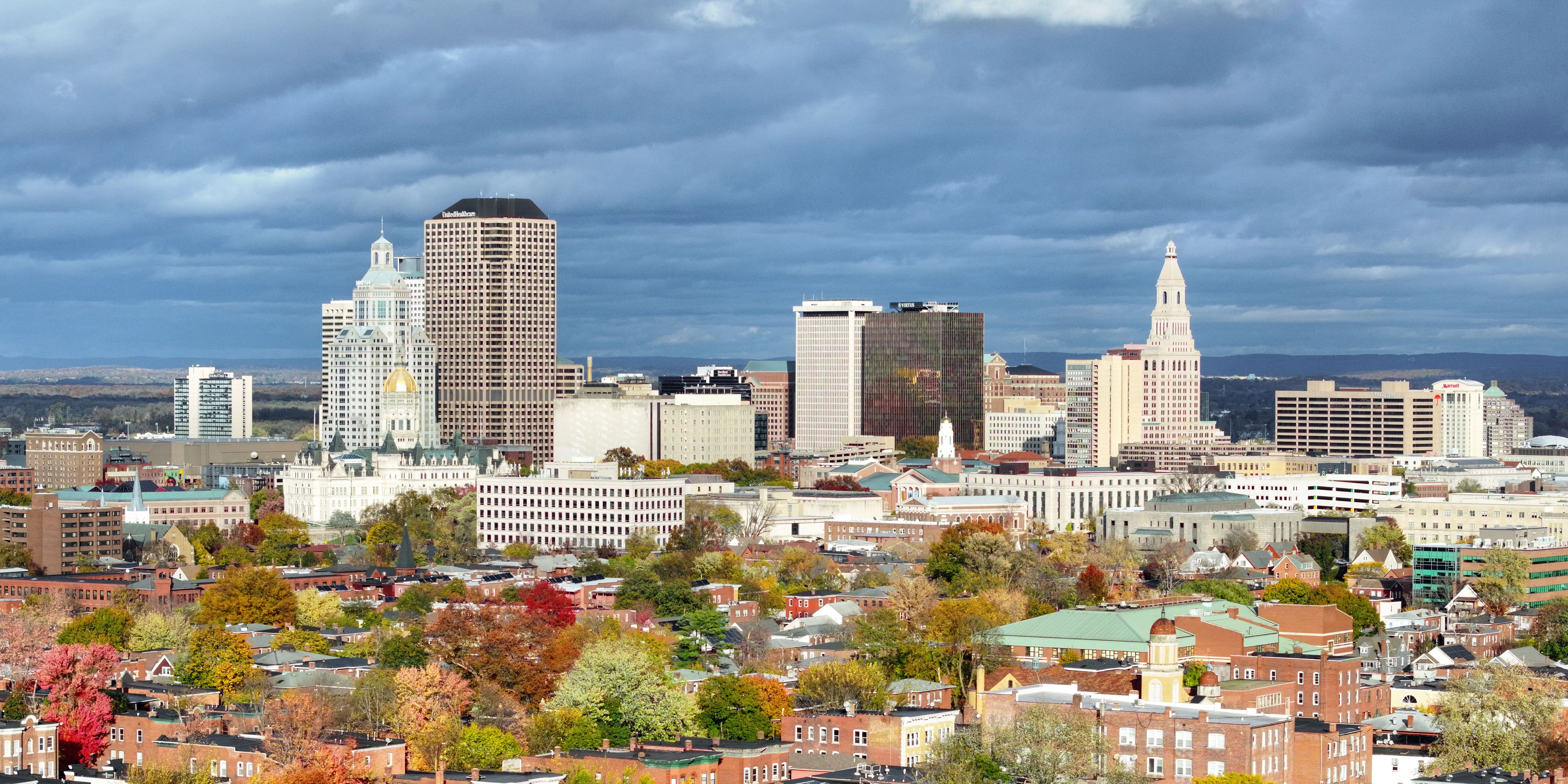 Hartford Connecticut downtown skyline with city buildings and fall foliage representing a major auto transport destination