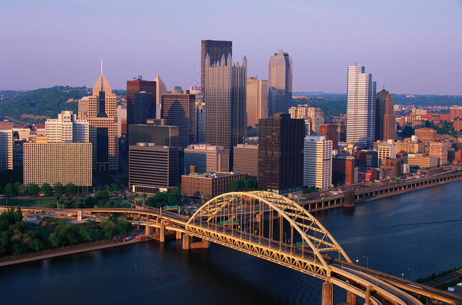 downtown pittsburgh pennsylvania skyline with river and yellow bridge viewed from above