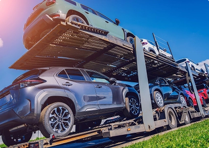 open car carrier truck transporting multiple vehicles